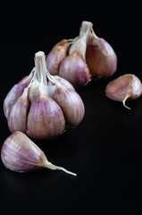  Garlic cloves on a dark background.jpg