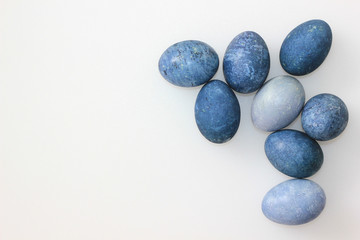 Fototapeta na wymiar easter eggs classic blue color on a white background, top wiew