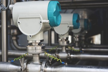Measurement equipment installed on stainless steel pipes in industrial systems