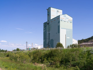 Fototapeta na wymiar Low angle view of a grain elevator, Drumheller, Red Deer River, Alberta, Canada