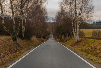Road near Ceske Budejovice city in south Bohemia in winter cloudy day