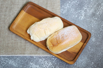 butter bread on wood plate, homemade bread with salt and sugar sweet desert.