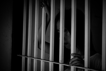 Hands of women desperate to catch the iron prison,prisoner concept,thailand people,Hope to be...