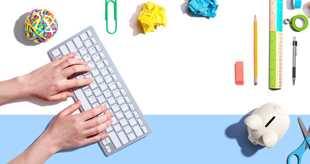 Woman using a computer keyboard - overhead view