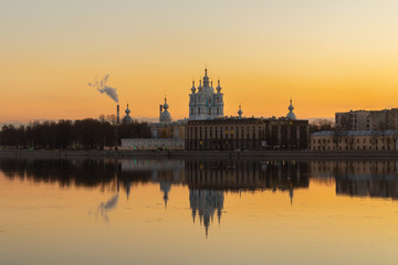 Smolny Cathedral at sunset. Saint Petersburg, Russia. View of the Neva river.