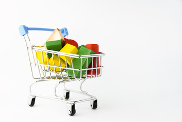 Coloring wooden toys with small shopping trolley or online chart on the white background
