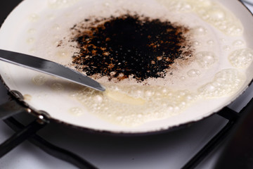 Melting butter on frying pan