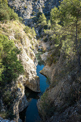 Obraz premium Small Mediterranean river, channeled between rocks
