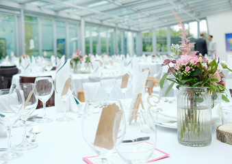 Before the event: Made tables with flowers and wineglasses