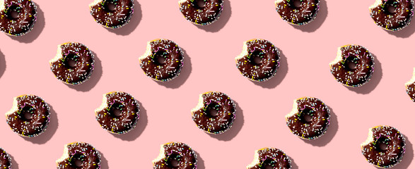 Chocolate glazed donuts overhead view flat lay