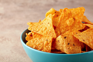 Mexican nachos or tortilla chips in a turquoise bowl