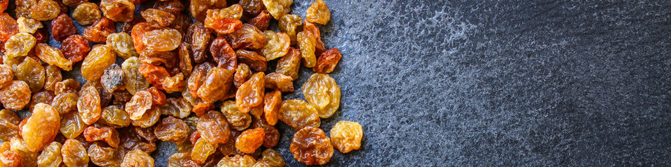 raisins, delicious dried grapes (fresh fruit vitamins) menu concept background. top view. copy space for text