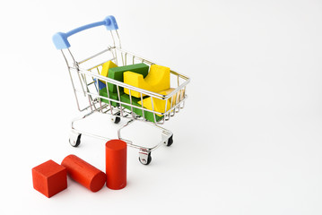 Coloring wooden toys with small shopping trolley or online chart on the white background
