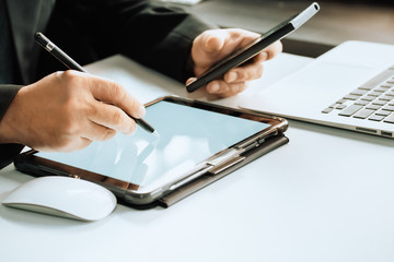 Business man using digital Pen tablet pointing on digital tablet screen at home office ,business and technology concept.