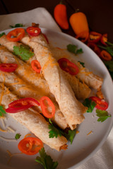 Cheese and chicken taquitos with jalapeño