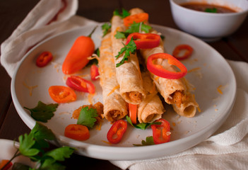 Cheese and chicken taquitos with jalapeño