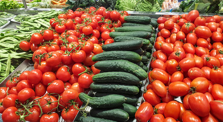 Tomatoes, cucumber, green beans and other vegetables in a market