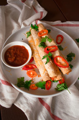 Cheese and chicken taquitos with jalapeño