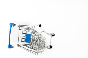 Small shopping trolley on the white background