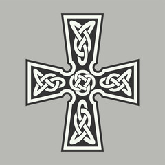Celtic ornament in the form of a cross. Isolated vector.