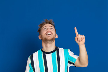 Fototapeta premium Attractive young guy with a striped T-shirt