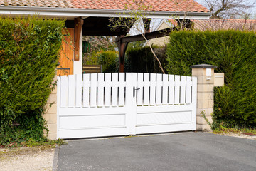 white metal aluminum house gate and slats