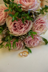 Wedding rings with wedding bouquet