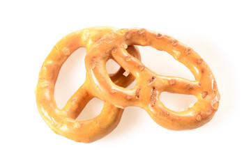 Pretzels, two mini snacks with salt for beer. Savory backed beer snack. Macro close-up isolated on white background