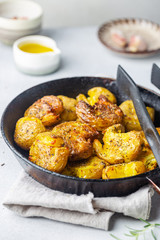 Homemade baked smashed baby potatoes with garlic, salt and herbs