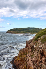 View towards Hammaerhavn Harbour form Baltic Sea coast, Bornholm island, Denmark.