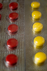 Colored pills close-up. Coronavirus vaccine concept macro