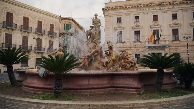 Diana fountain in the center of Siracusa, sculpture of Archimede Square (piazza Archimede) in the old part of Siracusa, Ortygia island in Sicily, Italy 