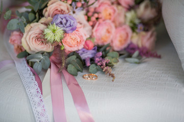 Wedding rings with wedding bouquet