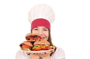 happy female cook with vegan sandwiches