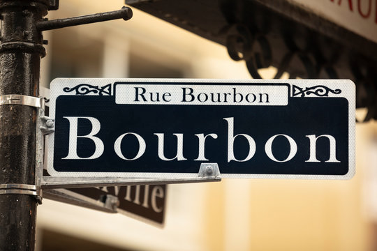 Bourbon Street road sign hangs in the French Quarter of New Orleans Louisiana USA