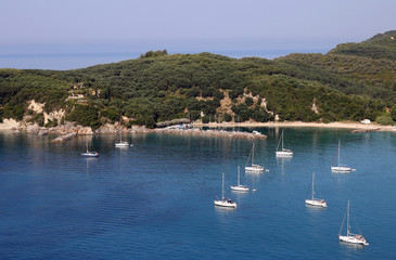 Fototapeta na wymiar yachts and sailboats on Valtos beach Parga Greece