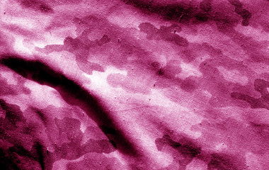 Part of military camouflage uniform close-up with blur effect in pink tone. © pavelalexeev