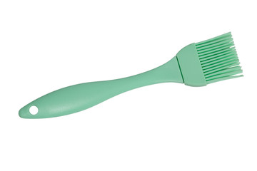 Green culinary brush, kitchen utensil. Isolated on white background