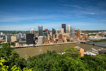 Fototapeta premium City skyline view over the Allegheny River and Roberto Clemente Bridge in downtown Pittsburgh Pennsylvania USA