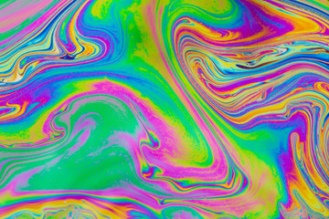 Psychedelic abstract background. Photo macro shot with light interference on the surface of a soap bubble