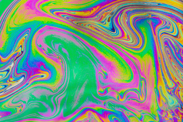 Psychedelic abstract background. Photo macro shot with light interference on the surface of a soap bubble