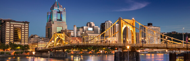 City panoramic skyline view over the Allegheny River and Roberto Clemente Bridge in downtown Pittsburgh Pennsylvania USA - obrazy, fototapety, plakaty