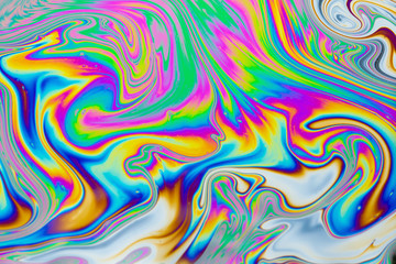 Psychedelic abstract background. Photo macro shot with light interference on the surface of a soap bubble