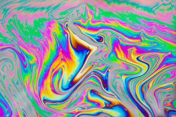 Psychedelic abstract background. Photo macro shot with light interference on the surface of a soap bubble