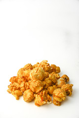Caramel pop corn on white background