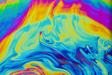 Psychedelic multicolored patterns background. Photo macro shot of soap bubbles