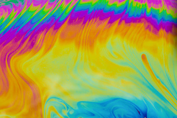 Fototapeta na wymiar Psychedelic multicolored patterns background. Photo macro shot of soap bubbles