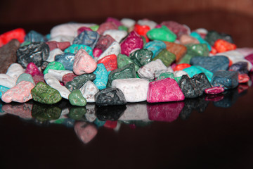 Reflection of the candy on the table. Chocolate in the form of rubble.