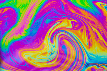 Psychedelic multicolored patterns background. Photo macro shot of soap bubbles