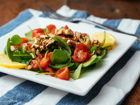Winter purslane salad with tomatoes and toasted walnuts